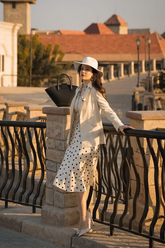 a lady wears a polka dots printed midi skirt with a blazer